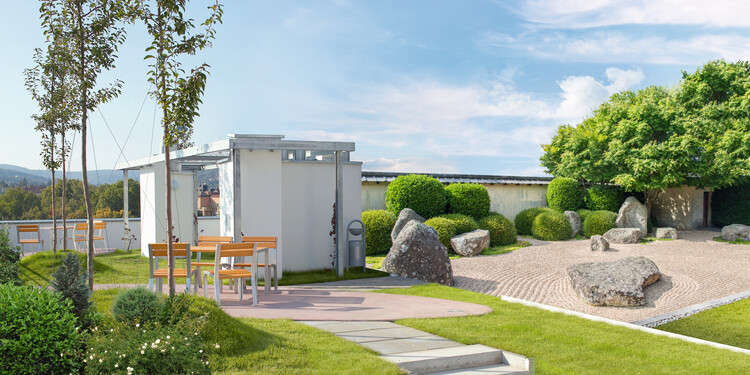 Dachgarten mit Begrünung, Grasflächen und Sitzgelegenheit mit moderner Gartenarchitektur und Zen-Garten.
