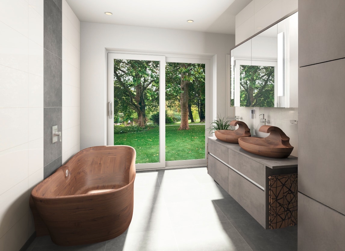 Freistehende runde Badewanne aus Walnuss und ein schwebender Waschtisch in grauer Betonoptik mit zwei ovalen aufgesetzten Massivholz-Waschbecken mit integriertem Wasserauslauf ebenfalls aus Walnuss von FESTWOOD.