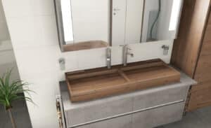 Ein schwebender Waschtisch in grauer Betonoptik mit einem rechteckigen aufgesetzten Massivholz-Doppelwaschbecken aus Walnuss von FESTWOOD.