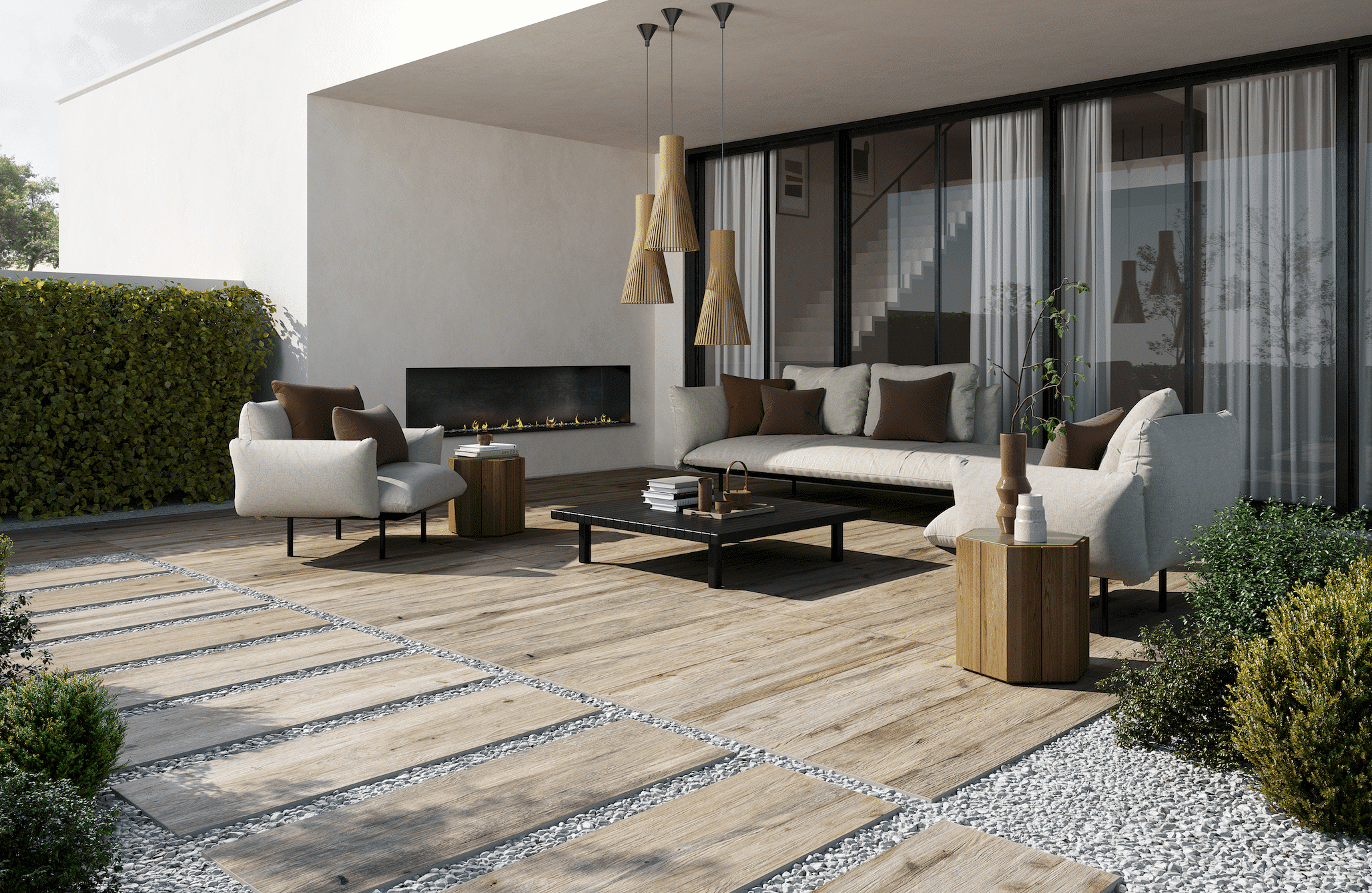 Fliesendorf zeigt eine Terrasse mit großer Lounge, einem Kamin, und großen Fliesendielen im Holzlook.