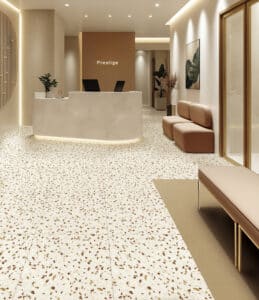 Gerflor zeigt einen Design-Bodenbelag in Steinoptik in einem großen Empfangsraum.