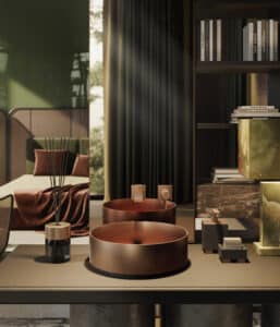 GESSI zeigt ein freistehendes rundes Waschbecken aus Kupfer mit einer kupferfarbenen Armaturen, die auf der Spiegelrückwand montiert sind.