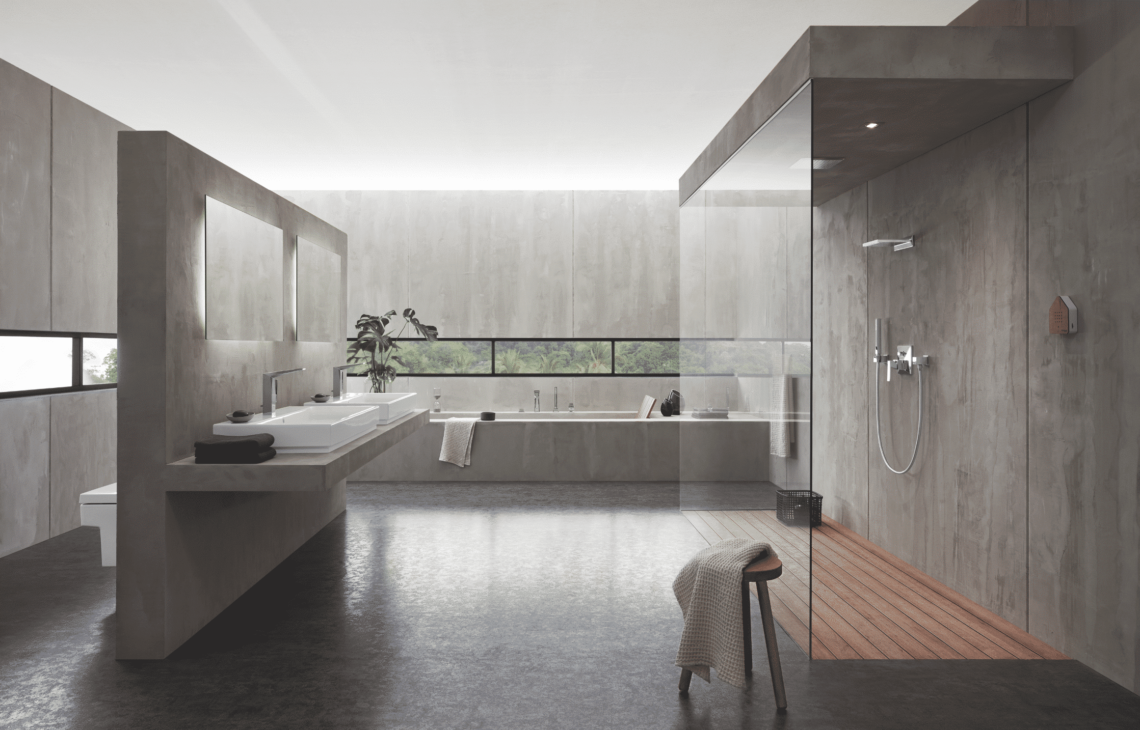 Grohe zeigt ein hellgraues Bad mit Walk-In Dusche, einer Glasduschwand, und zwei Waschbecken.