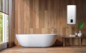 Hajdu zeigt ein Badezimmer mit freistehender Badewanne und einem Gerät zur Warmwasseraufbereitung.