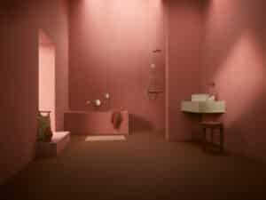 Hansa zeigt ein puristisches Badezimmer in Terrakotta Farbe mit Badewanne, Dusche und Waschbecken mit Hansa VANTIS und VIVA Armaturen.