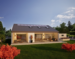 Hartl Haus zeigt Bungalow mit Satteldach und einer großen Terrasse mit Stufen in den Garten bei Abendstimmung.