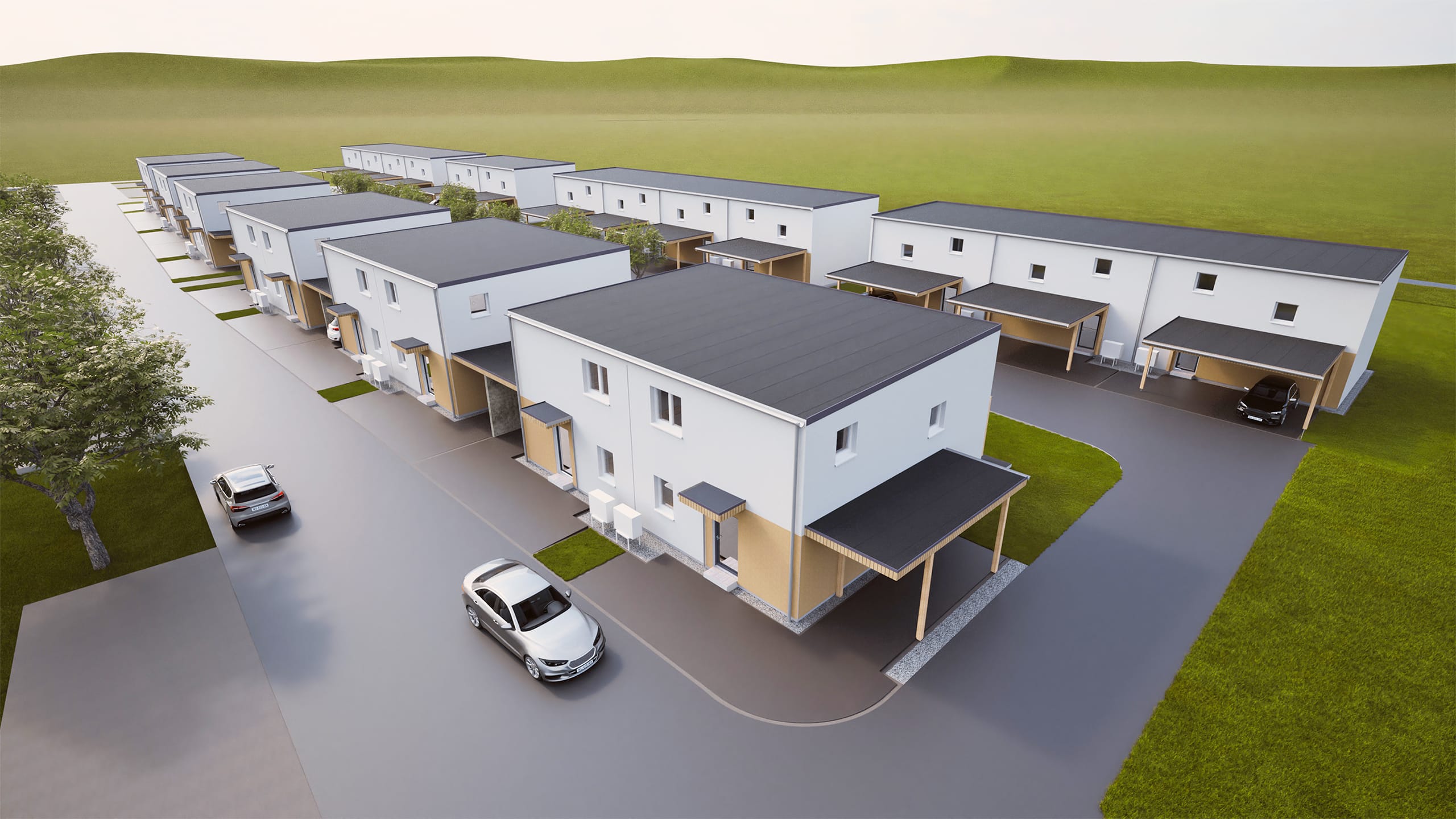 Eine moderne Reihenhaussiedlung in zwei Reihen mit hellen, zweigeschossigen Häusern, Carports, überdachten Hauseingängen und grüner Umgebung in ruhiger Lage von HARTL HAUS.