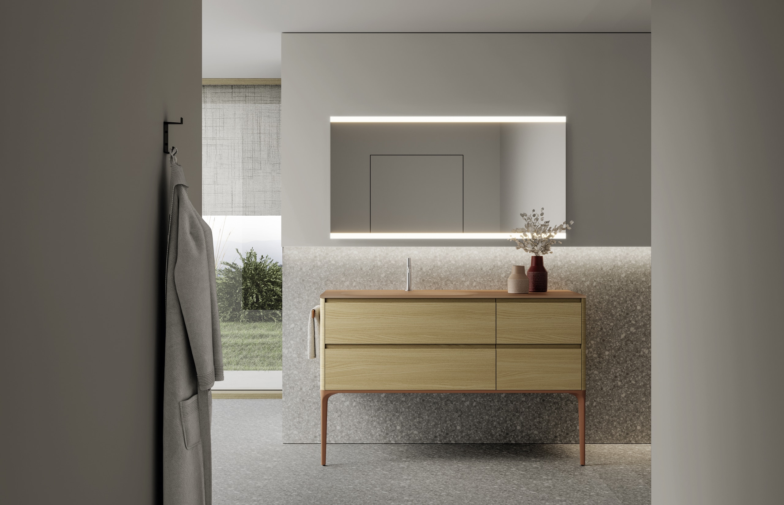 Idea Group zeigt einen Vorraum mit Sideboard aus hellem Holz und großen Schubladen und einem beleuchteten rechteckigen Spiegel.