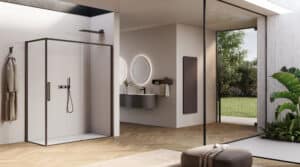 Disenia von Idea Group präsentiert eine mit zwei Glaswänden geschlossene Dusche mit anthrazit farbigem Rahmen und Türgriff, schwarzer Armatur, Handdusche und Regendusche.