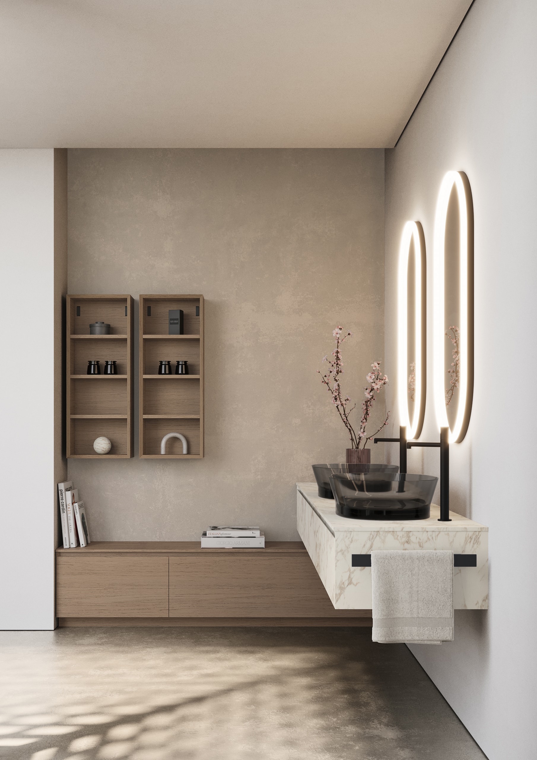 Idea Group präsentiert einen Waschtisch mit zwei freistehenden Rauchglas Waschbecken, einen weiss marmorierten Unterschrank mit Auszugsladen und Handtuchhalterung, zwei ovale Spiegel mit integrierter Beleuchtung, ein im rechten Winkel angebauter Schrank in Sitzhöhe und zwei offene Wandschränken aus Holz.