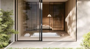 Der quadratische weiße Outdoor-Whirlpool "Gilium" von Disenia - hier in der Unterbauversion in einem japanisch-minimalistisch gestalteten Haus mit barrierefreiem Terrassenzugang.