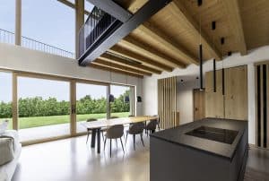 Internorm präsentiert einen offenen Wohnraum mit Galerie, großen Fenstern und Glasschiebetür auf die Terrasse.