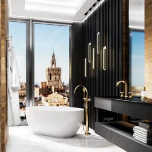 Jörger zeigt ein Badezimmer mit freistehender weißer Badewanne mit freistehender, goldener Wannen-Einhandbatterie und goldener Armatur auf schwarzem Waschtisch.