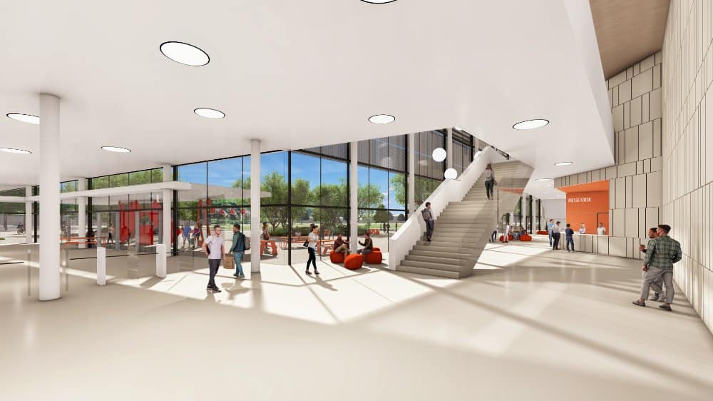 Ein Innenrendering der „WE BUILD“-Energiesparmesse in Wels mit weitläufiger Messehalle, hohen Decken und klar strukturierten Ausstellungsbereichen.