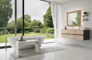 Ein modernes Badezimmer von Limbach mit freistehender Badewanne und einer Terrasse mit Glasschiebetüre und Vorhang schafft helle, ruhige Wellness-Atmosphäre.
