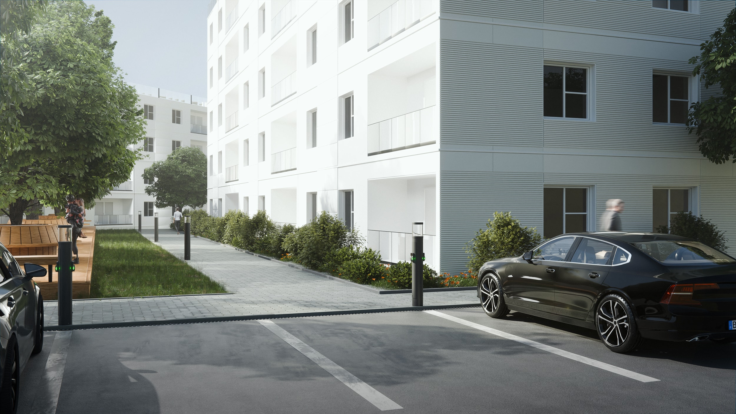Licht-/Ladesäulen von RZB Energy auf einem Parkplatz und Wegen in einer Wohnsiedlung.