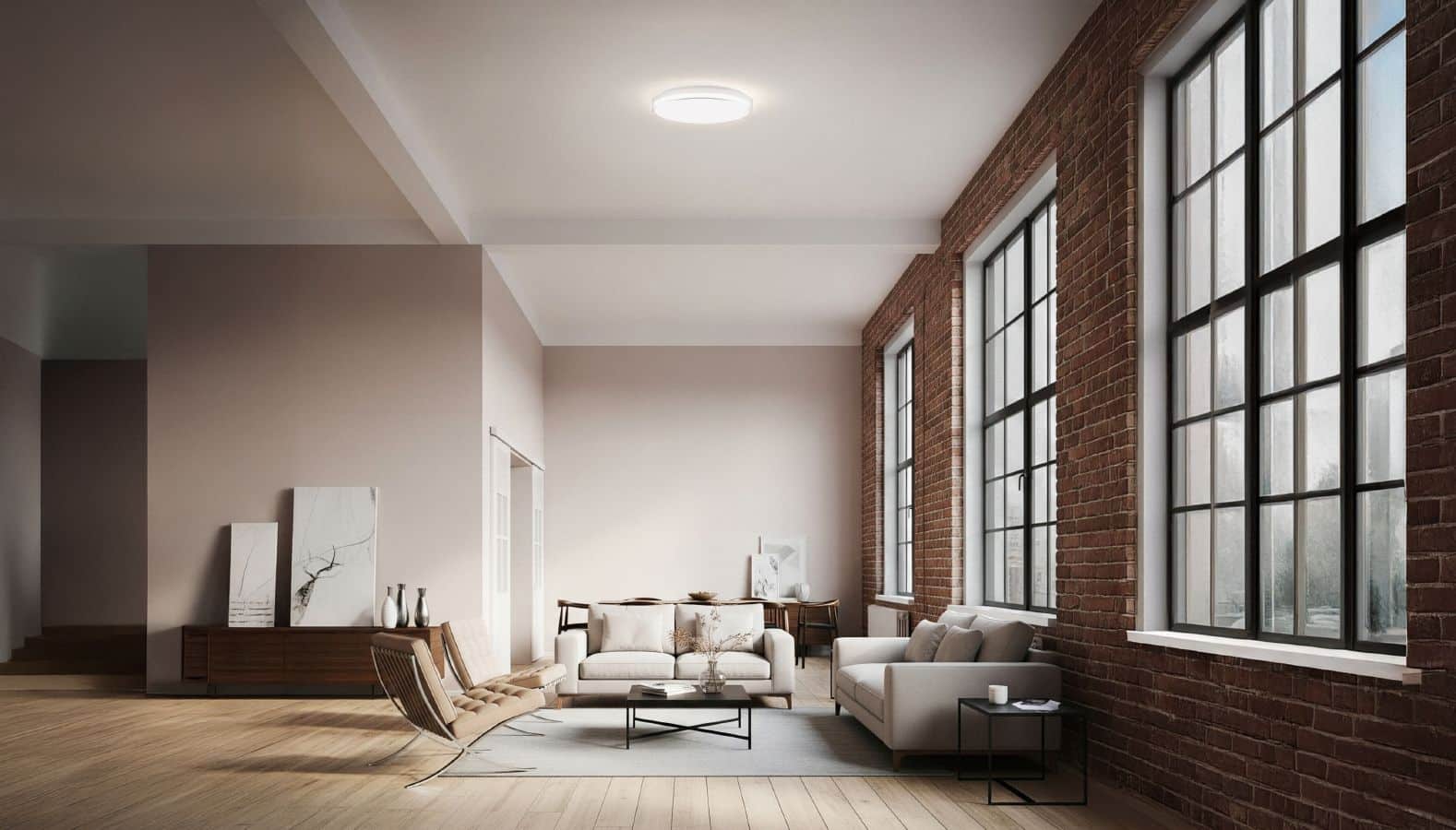 Ein großer offener Wohnbereich, der mit Deckenleuchten von RZB ausgestattet ist.