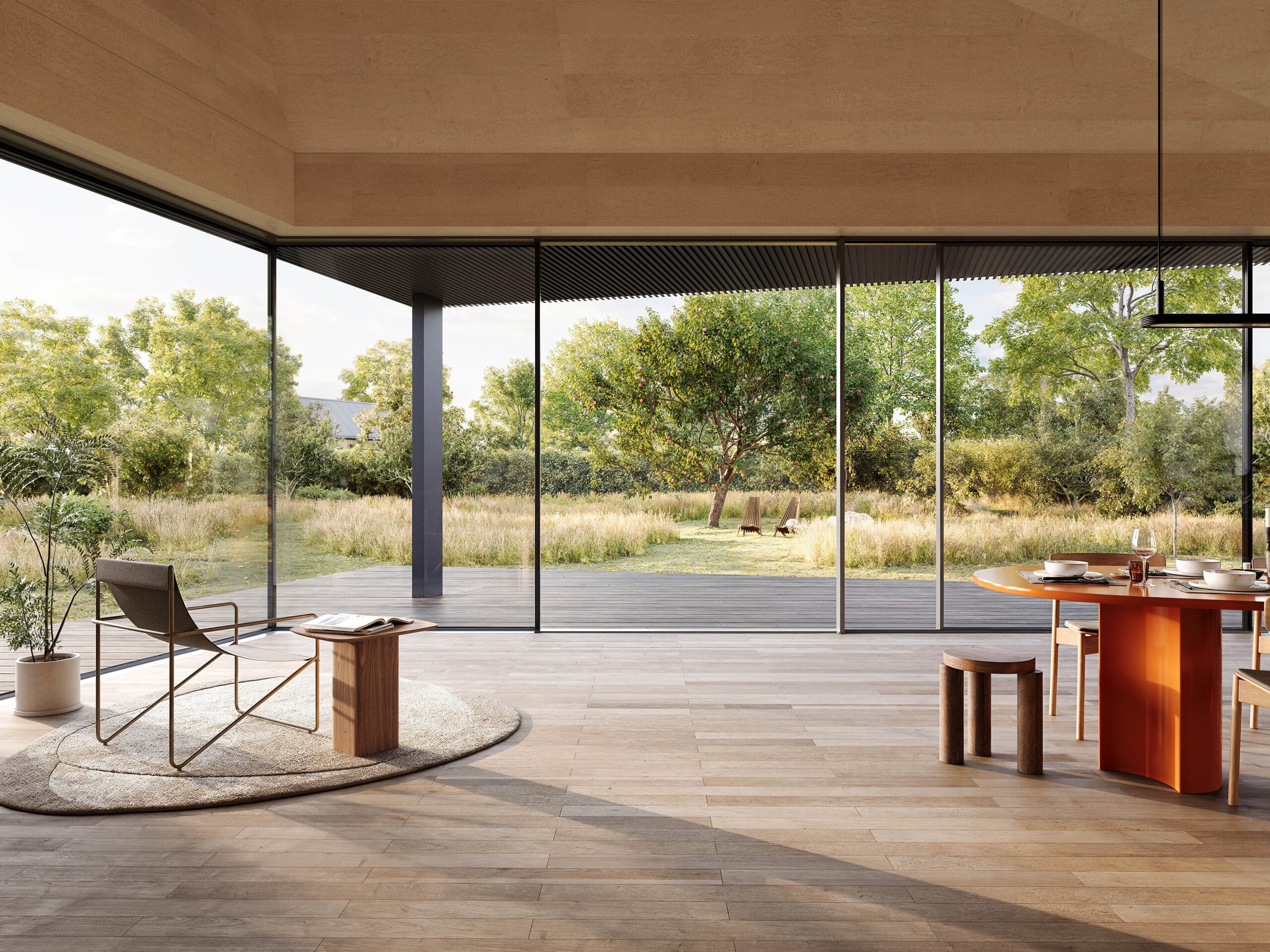 Vom grossen hellen Wohnraum mit Ganzglassystem und Glasschiebeelemente von Solarlux gelangt man barrierefrei in den Garten.