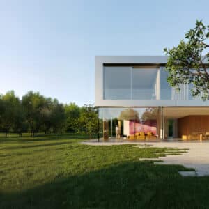 Ein modernes Einfamilienhaus schafft mit den rahmenlosen Schiebefenstern „Cero“ einen fließenden Übergang zwischen lichtdurchflutetem Wohnbereich und weitläufigem Garten – von Solarlux.