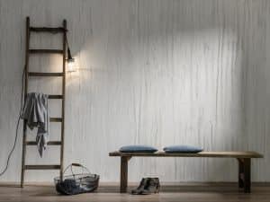 SynthesaGruppe zeigt einen Eingangsbereich mit einer Wand mit Kreativtechnik mit Caparol.