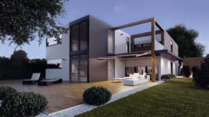 Ein modernes Flachdachhaus mit einem Mix aus Fassadenelementen, verschiedenen Aussenjalousien, bodentiefen Fenstern und Glaselementen, Balkon mit Nurglasgeländer, Garten, Terrasse mit Holzdielen, Markise und Outdoor‑Möbeln, funktional gestaltet von WAREMA.