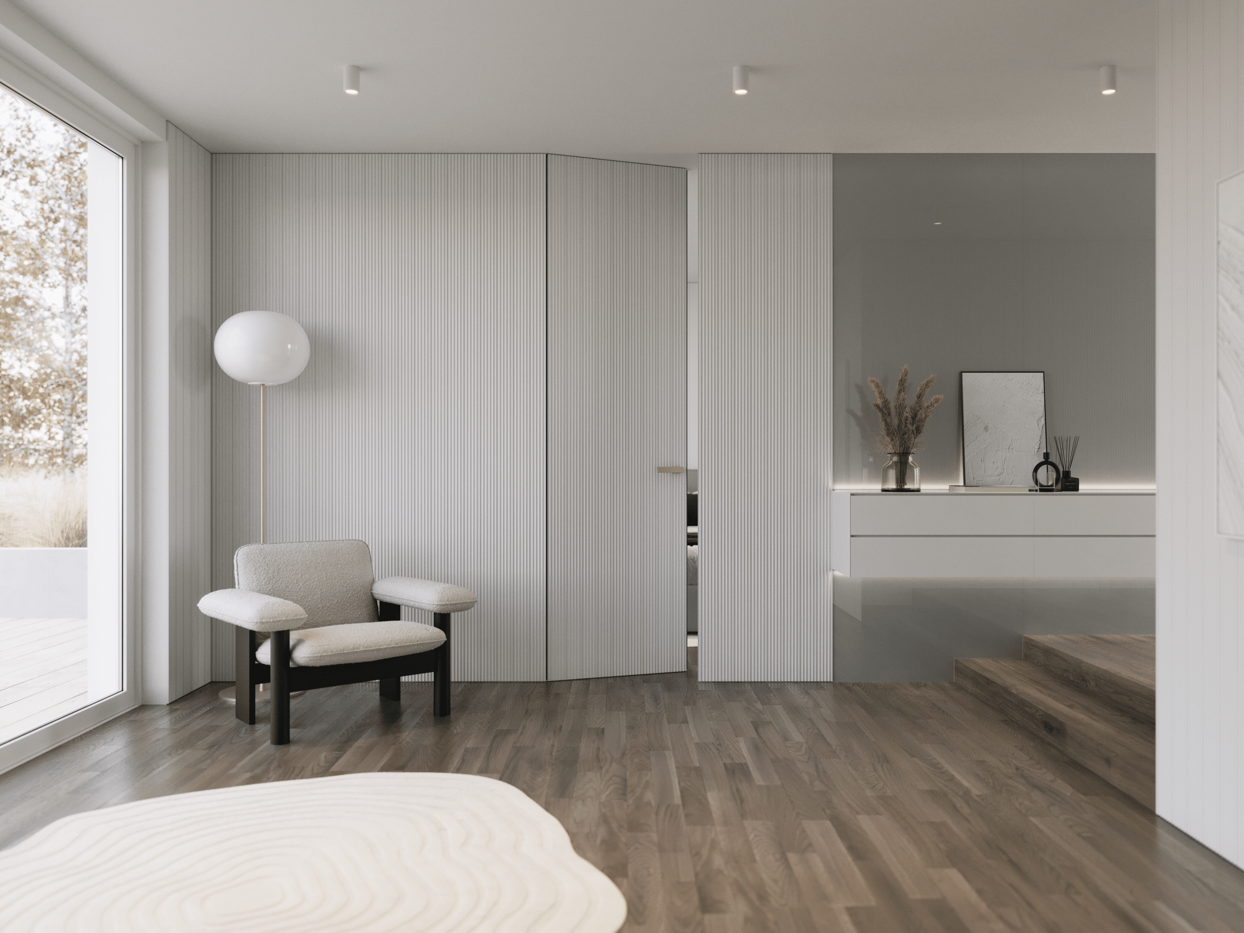 Moderner Wohnraum mit Blick auf die Terrasse, Deckenspots, niedrigem Loungesessel, Stehleuchte und einer Wandabtrennung mit Teilverglasung und schwebendem Sideboard, deckenhoher fast unsichtbarer Tür zum Schlafzimmer mit Rundum-Wandverkleidung in grauer Rillenoptik und Klinke in Bronze von WIENTÜR91.