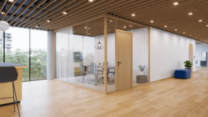 Ein abgetrennter Büro‑ bzw. Besprechungsraum aus Glastrennwand FUTRA mit Holzrahmen und Holztür von Wientür91.